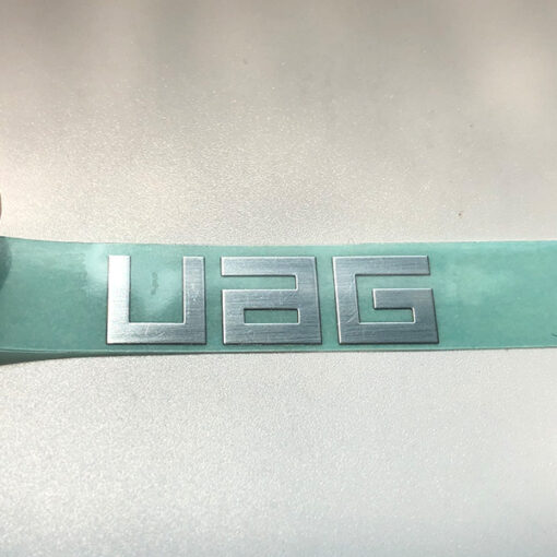 Autocollant métallique UAG 3 logos JTT | Chine Fabricants professionnels d'autocollants de logo métallique personnalisés, usine